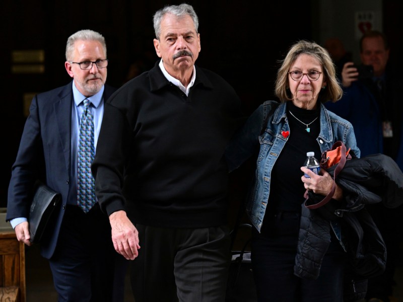 Former regulator Sam Randazzo leaves the court room along with his wife and lawyer following his Feb. 13 indictment.